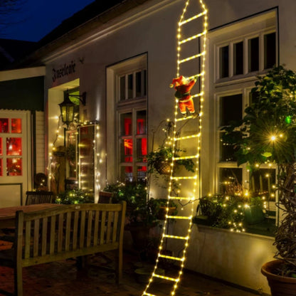 Père Noël lumineux sur échelle